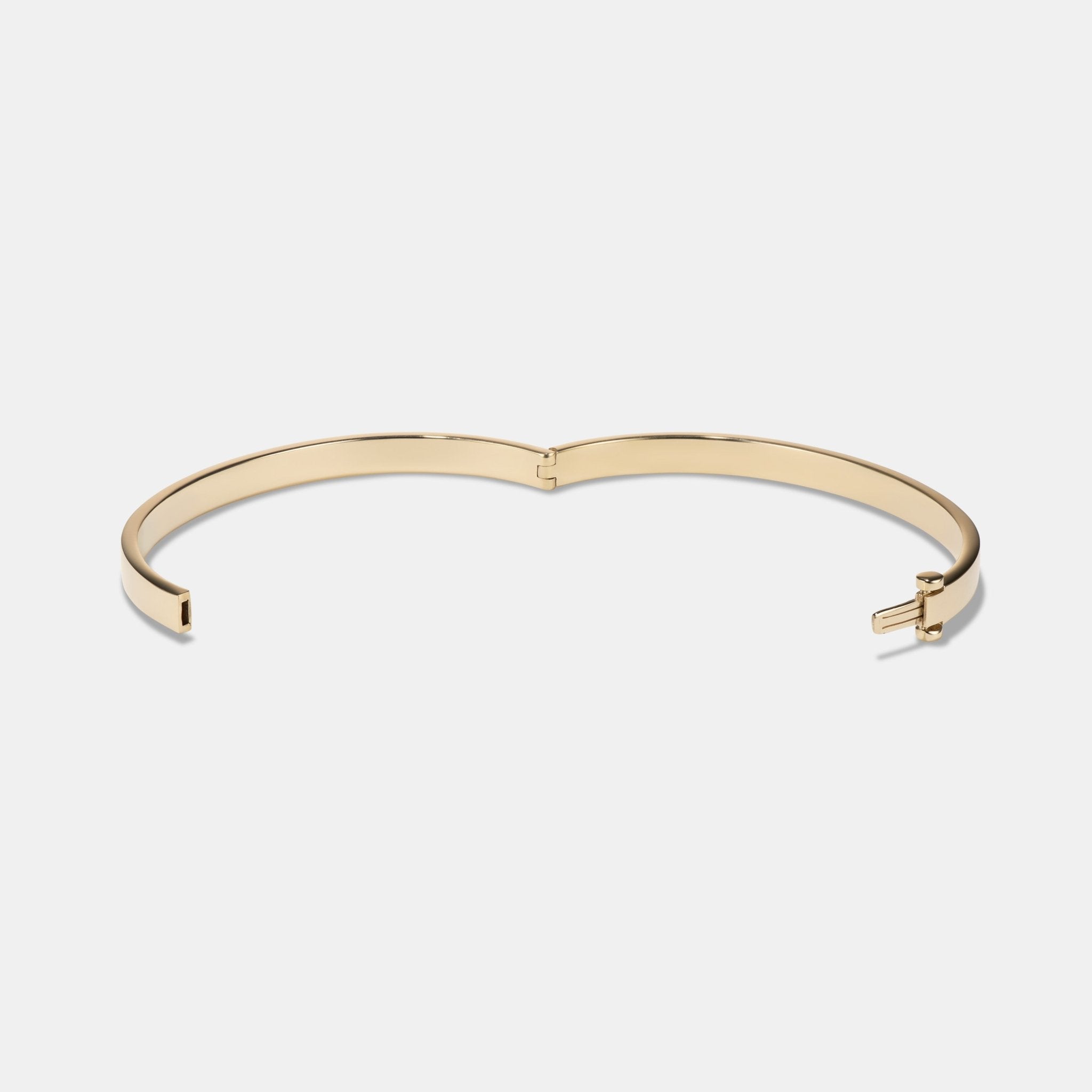 Hinged Bangle in 9 karat yellow gold